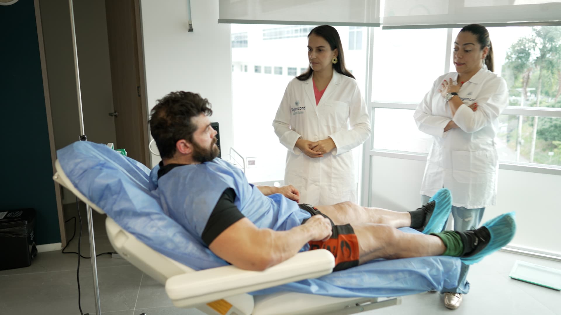 Brian Cage with doctors during treatment